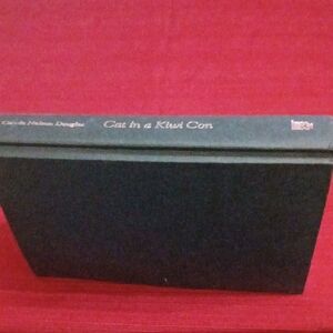 Cat in a Kiwi Con Hardcover Book - Black